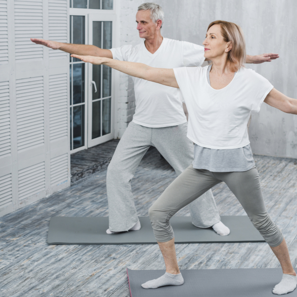 healthy-couple-performing-exercising-yoga-mat-home